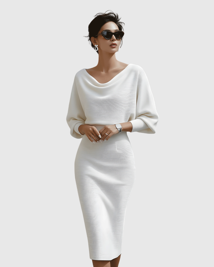 Model wearing white batwing midi dress with cowl neckline and sunglasses