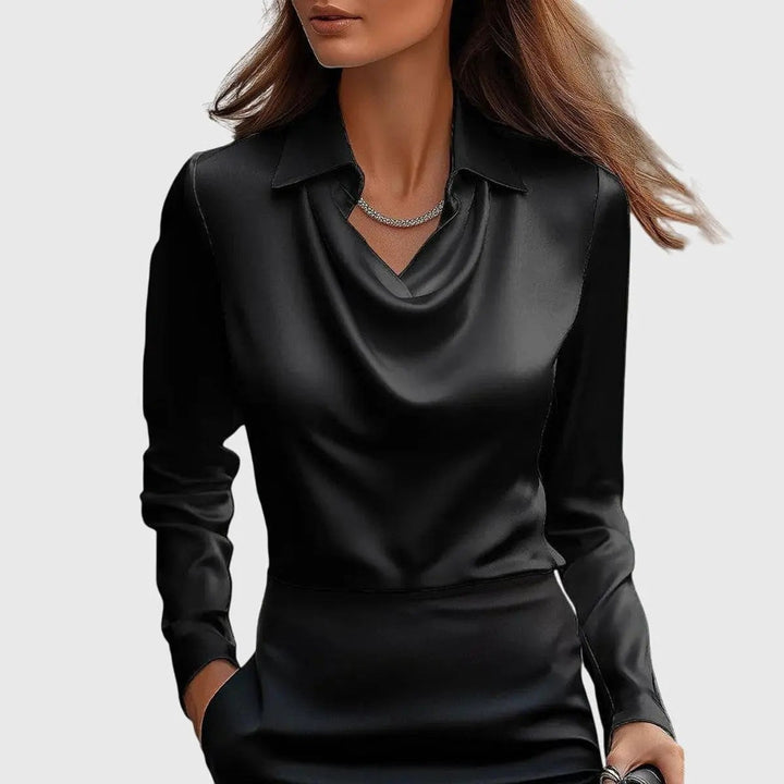 Black satin blouse with cowl neckline and structured collar, worn with a black skirt