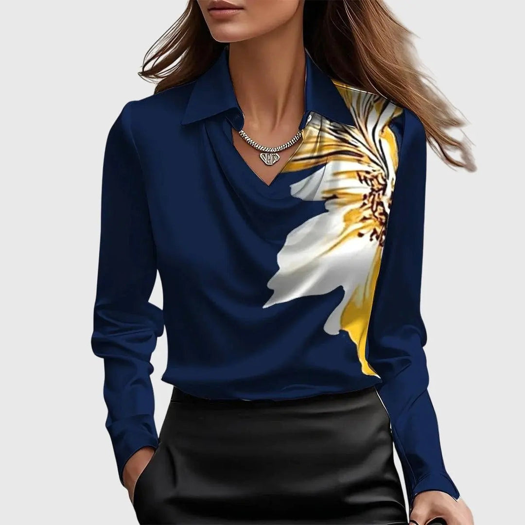 Navy satin blouse with a striking yellow and white floral accent near the collar