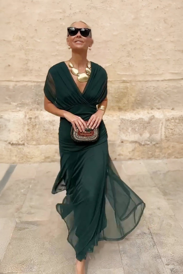 Emerald V-neck maxi dress with flowing tulle skirt and short sleeves