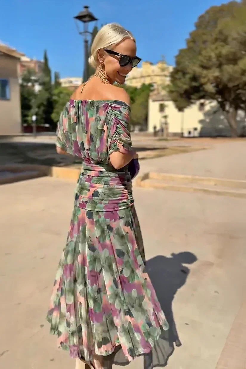 Rear view of ruched sleeve detail on off-shoulder floral maxi dress
