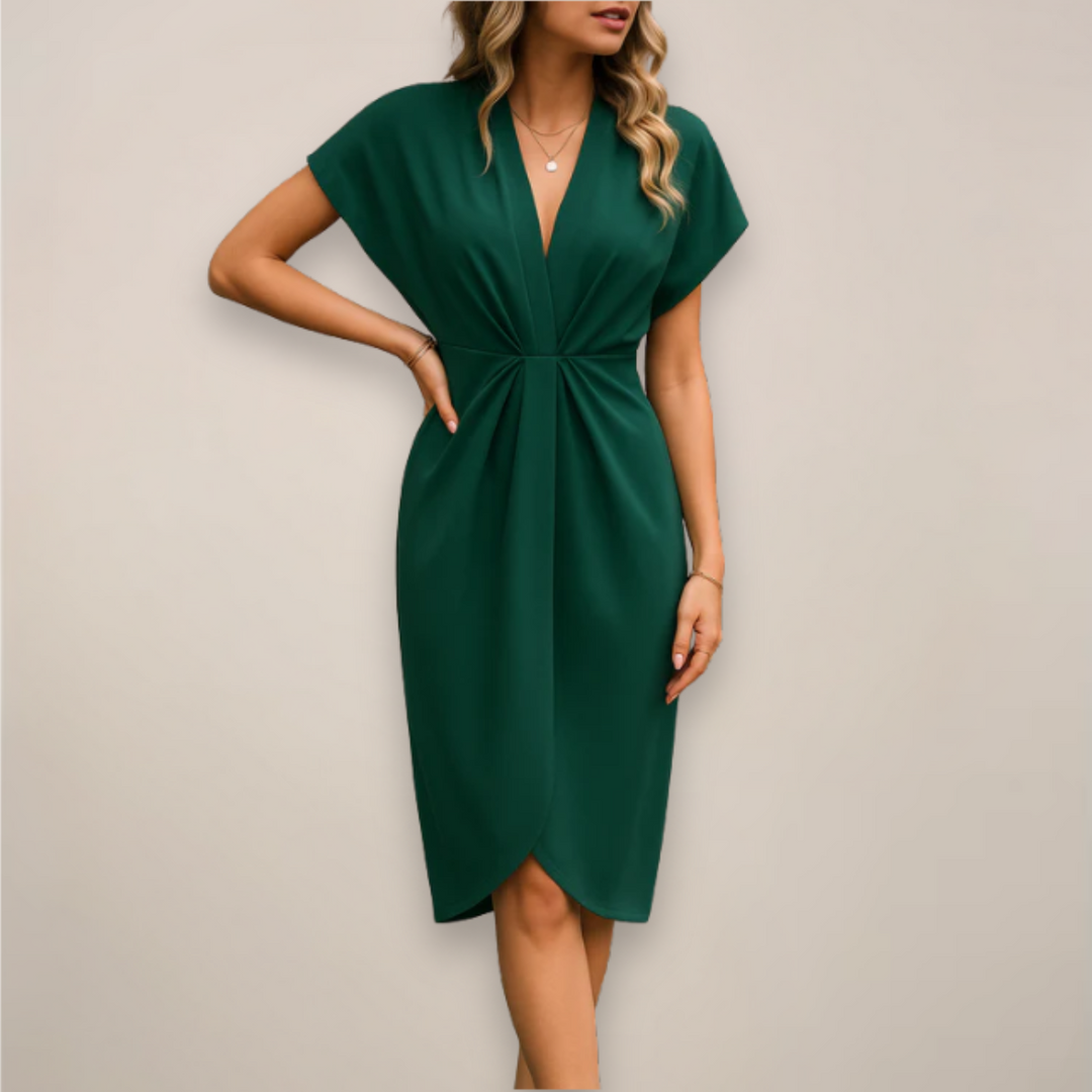 Emerald green wrap midi dress showing draped V-neckline and tulip hem