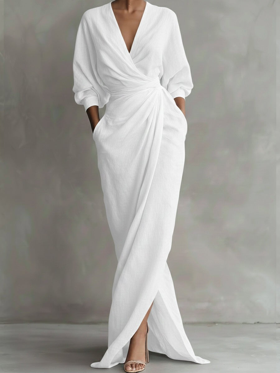 White linen wrap maxi dress showing draped front and side split