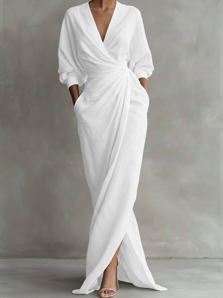 White linen wrap maxi dress showing draped front and side split