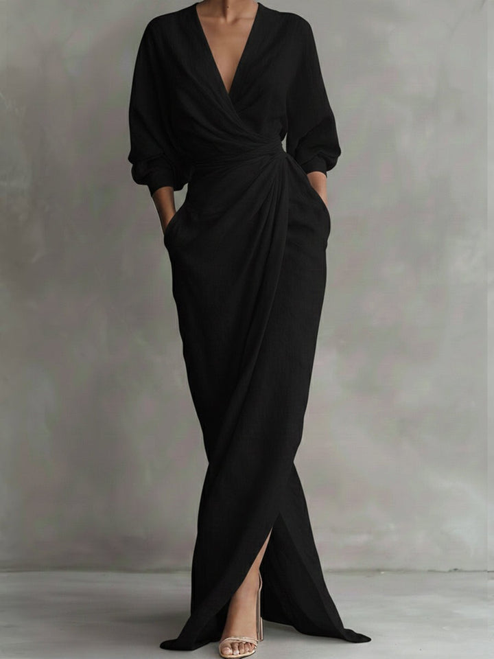 Black wrap maxi dress with plunging neckline and gathered waist drape