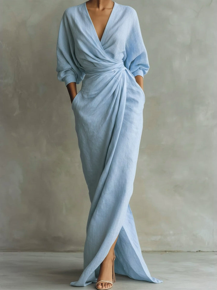 Pale blue linen wrap maxi dress with draped skirt and split hem