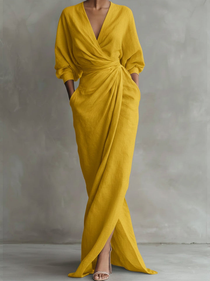 Mustard yellow wrap maxi dress featuring draped bodice and split skirt