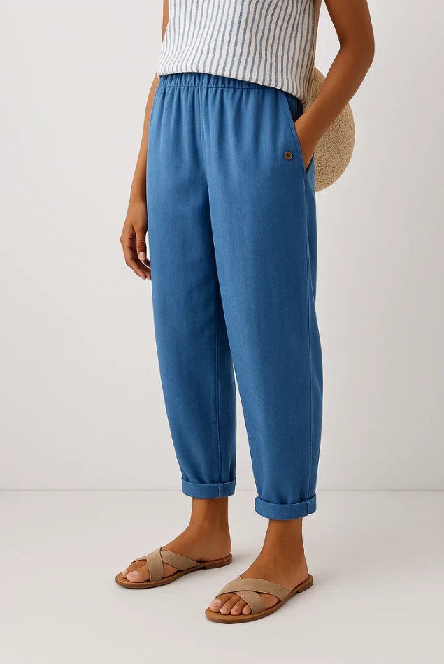 Denim blue turn-up trousers featuring elasticated waist and relaxed tapered fit