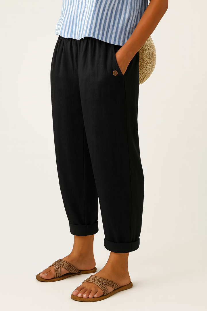 Black turn-up trousers with elasticated waist and slouchy tapered leg