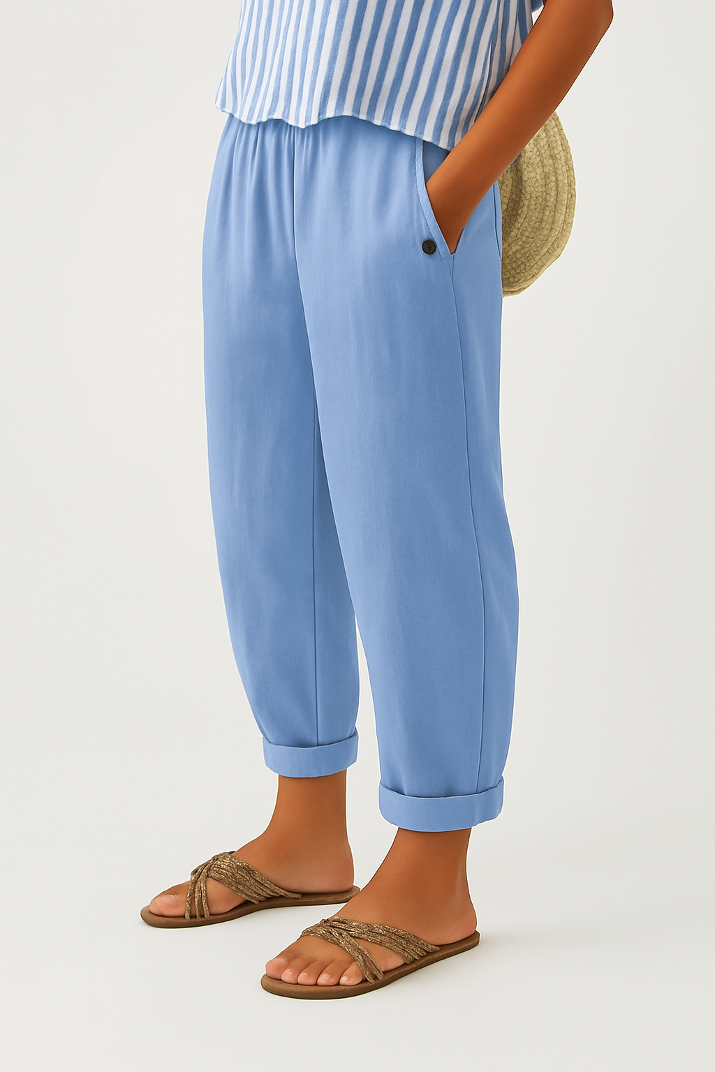 Sky blue cropped trousers featuring turn-up hem and relaxed tapered cut