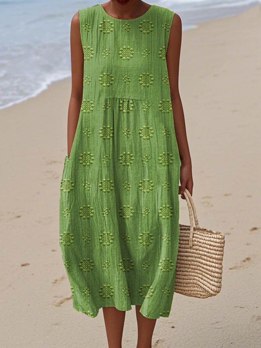 Green sleeveless midi dress with embroidered floral motif and side pockets