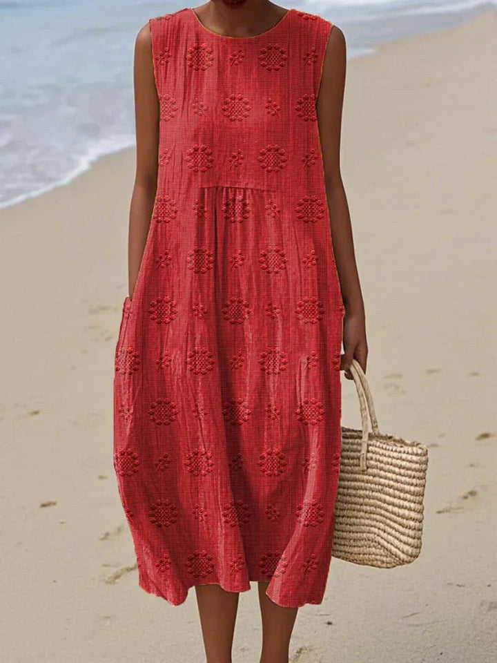Red sleeveless midi dress with embroidered floral texture and pockets