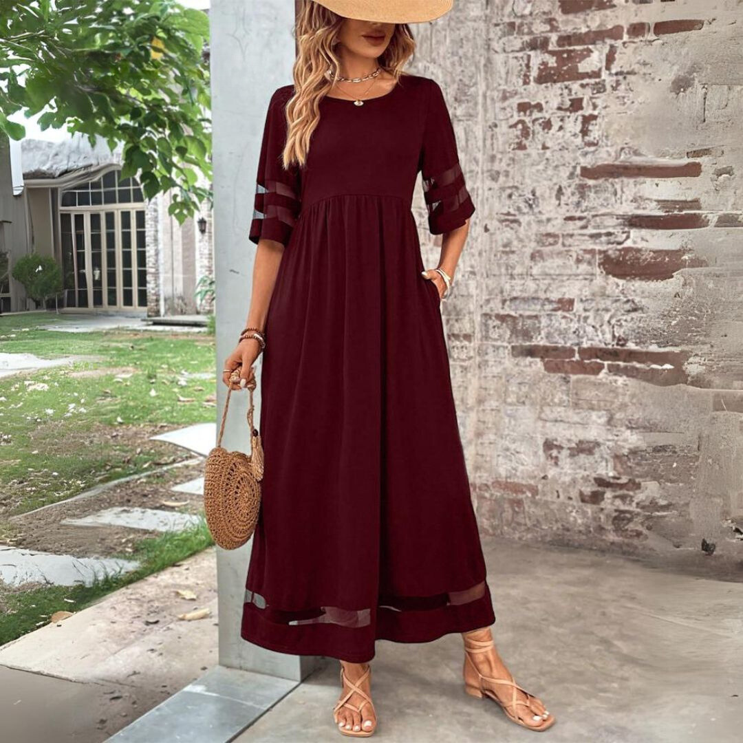 Burgundy maxi dress with sheer mesh sleeve trims and full skirt, styled with sandals