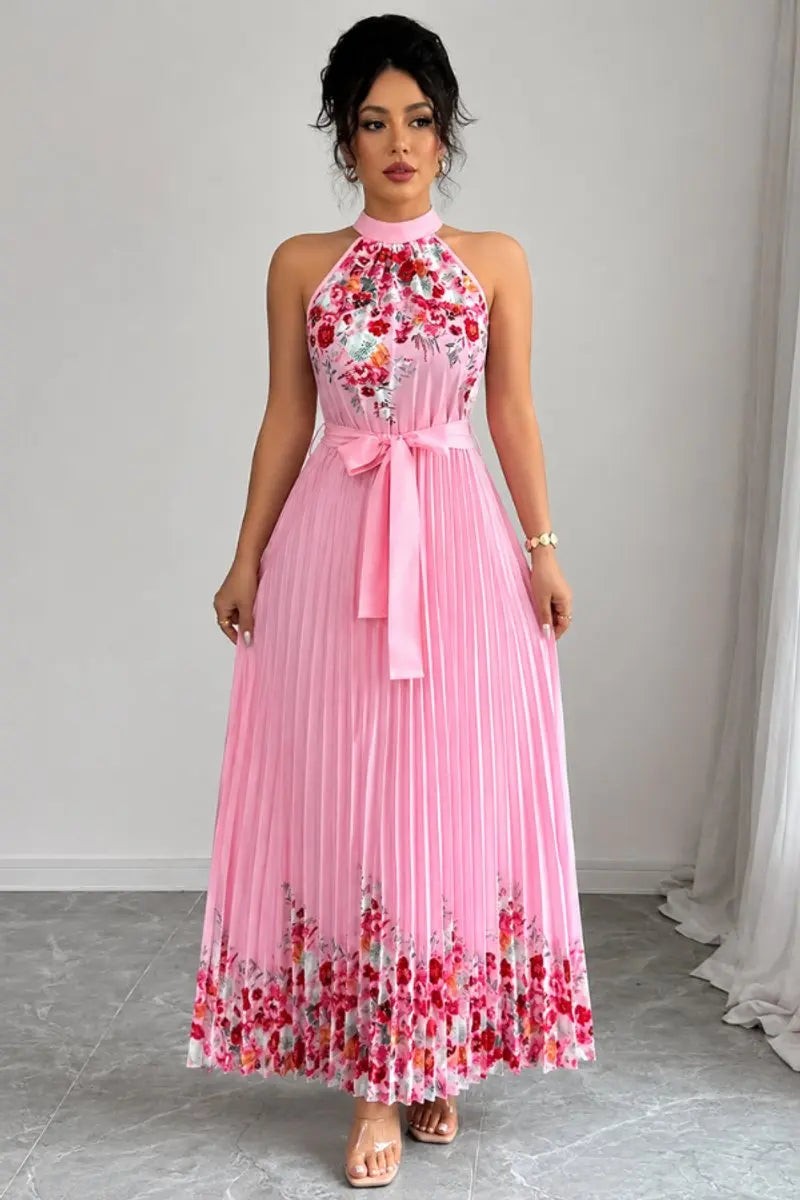 Pink halter-neck maxi dress with floral hem print and pleated skirt