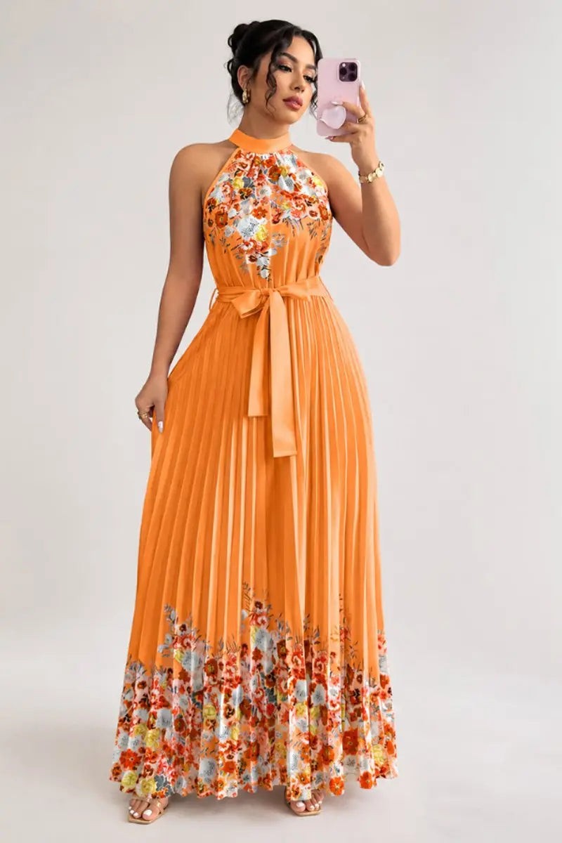 Orange pleated halter maxi dress with floral hem design