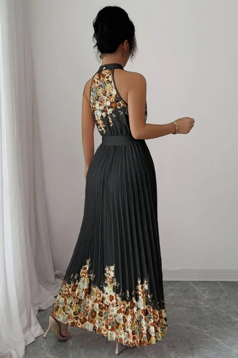 Rear view of charcoal pleated maxi dress with floral hem detailing