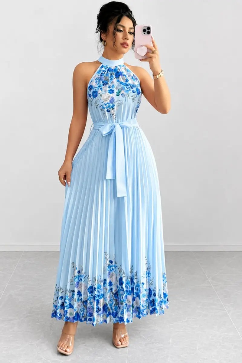 Pale blue pleated maxi dress with floral hem print and halter neckline