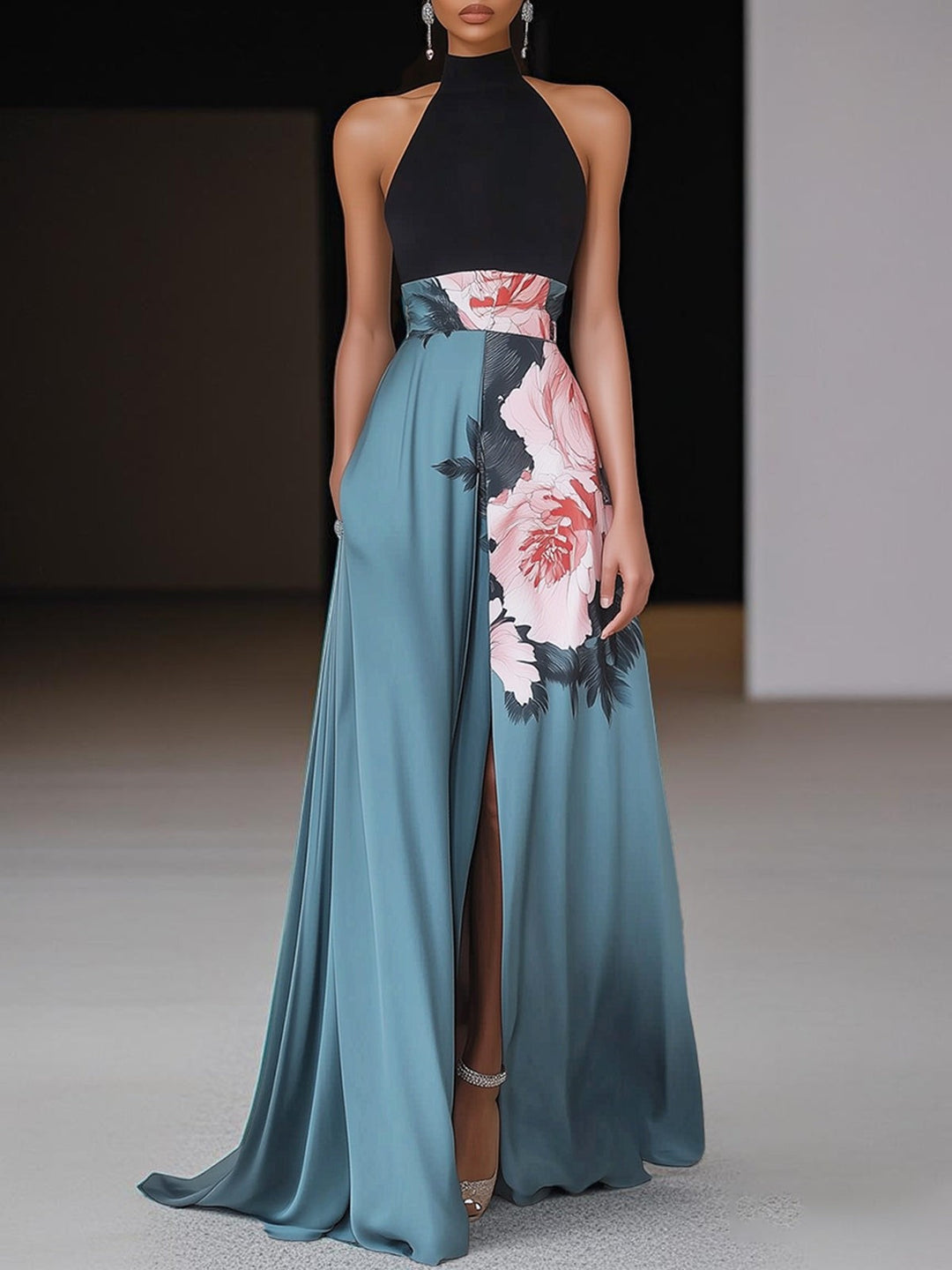 Halterneck maxi dress with black bodice and teal floral print skirt with thigh slit