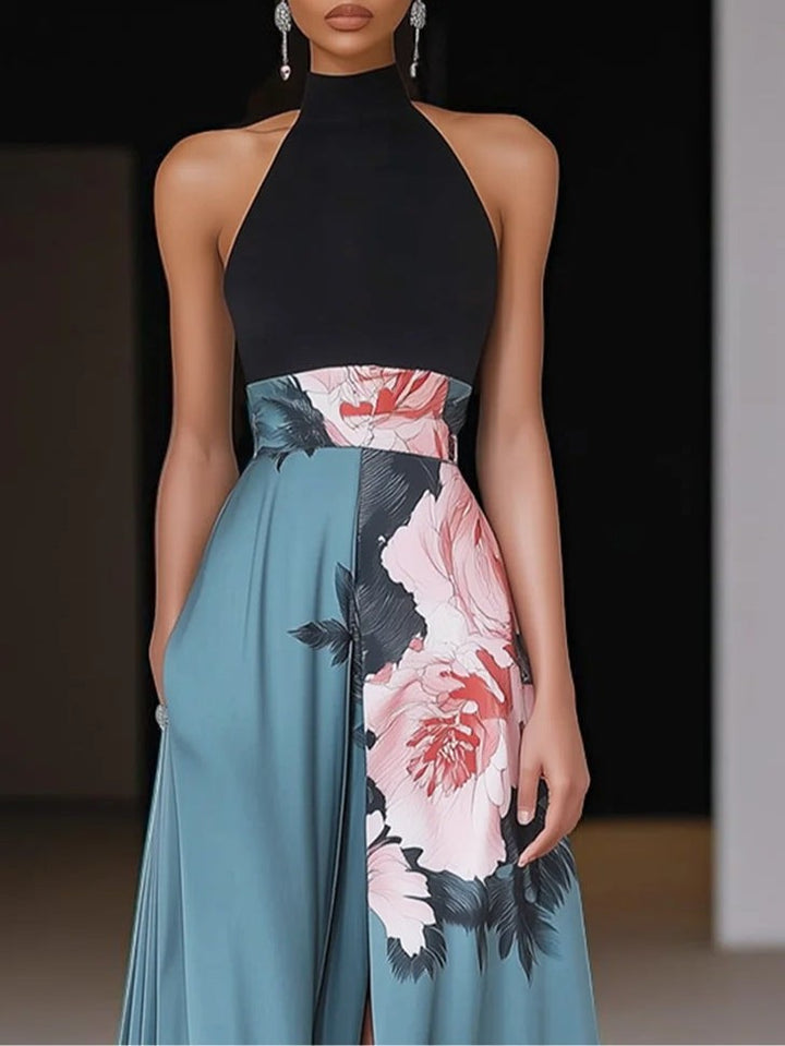 Close-up of black halterneck bodice on floral teal maxi dress with high collar