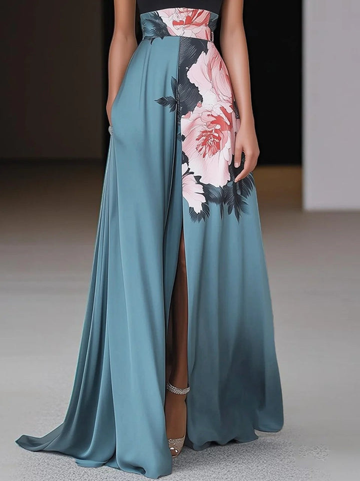 Teal floral maxi skirt with thigh-high slit and flowing satin-effect fabric