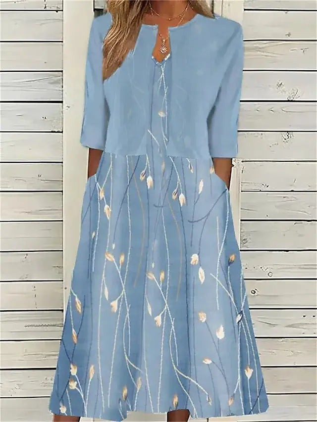 Powder blue midi dress with layered jacket effect and floral leaf print