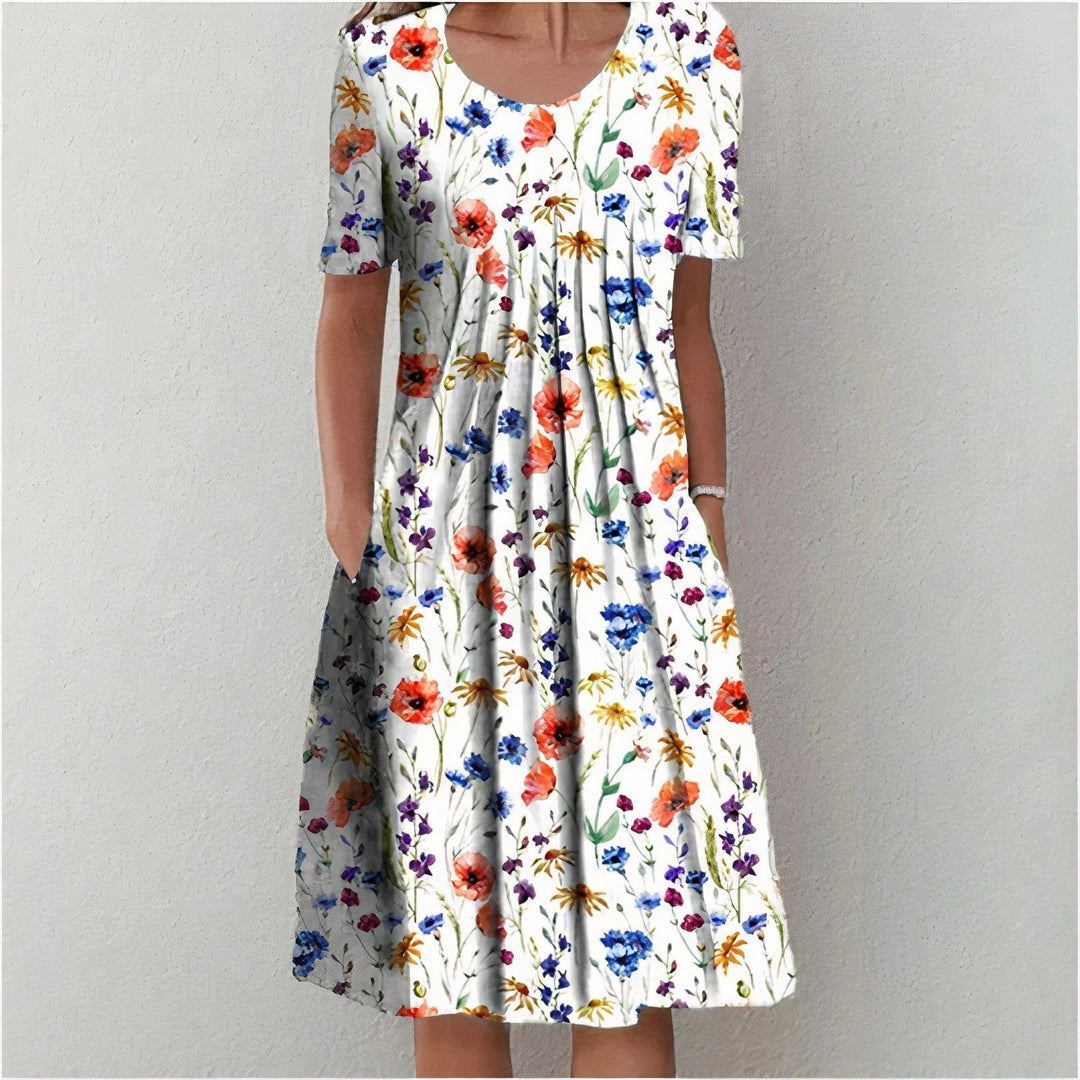 Short-sleeved midi dress featuring colourful watercolour floral print on white