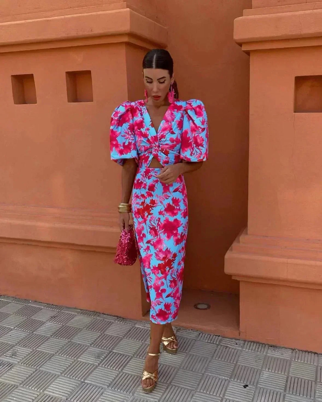 Blue and pink floral midi dress with puff sleeves and cut-out waist detail