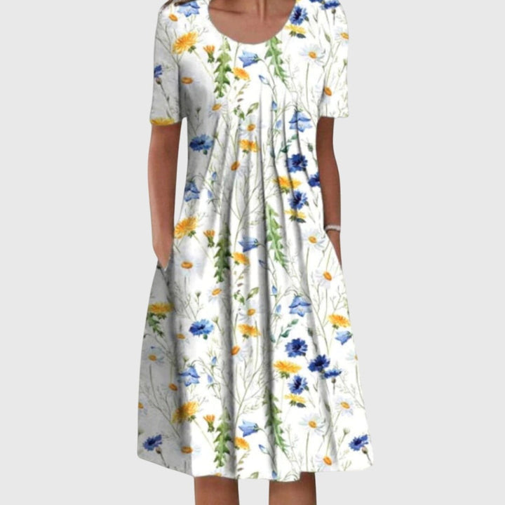 White midi dress with blue and yellow daisy floral print