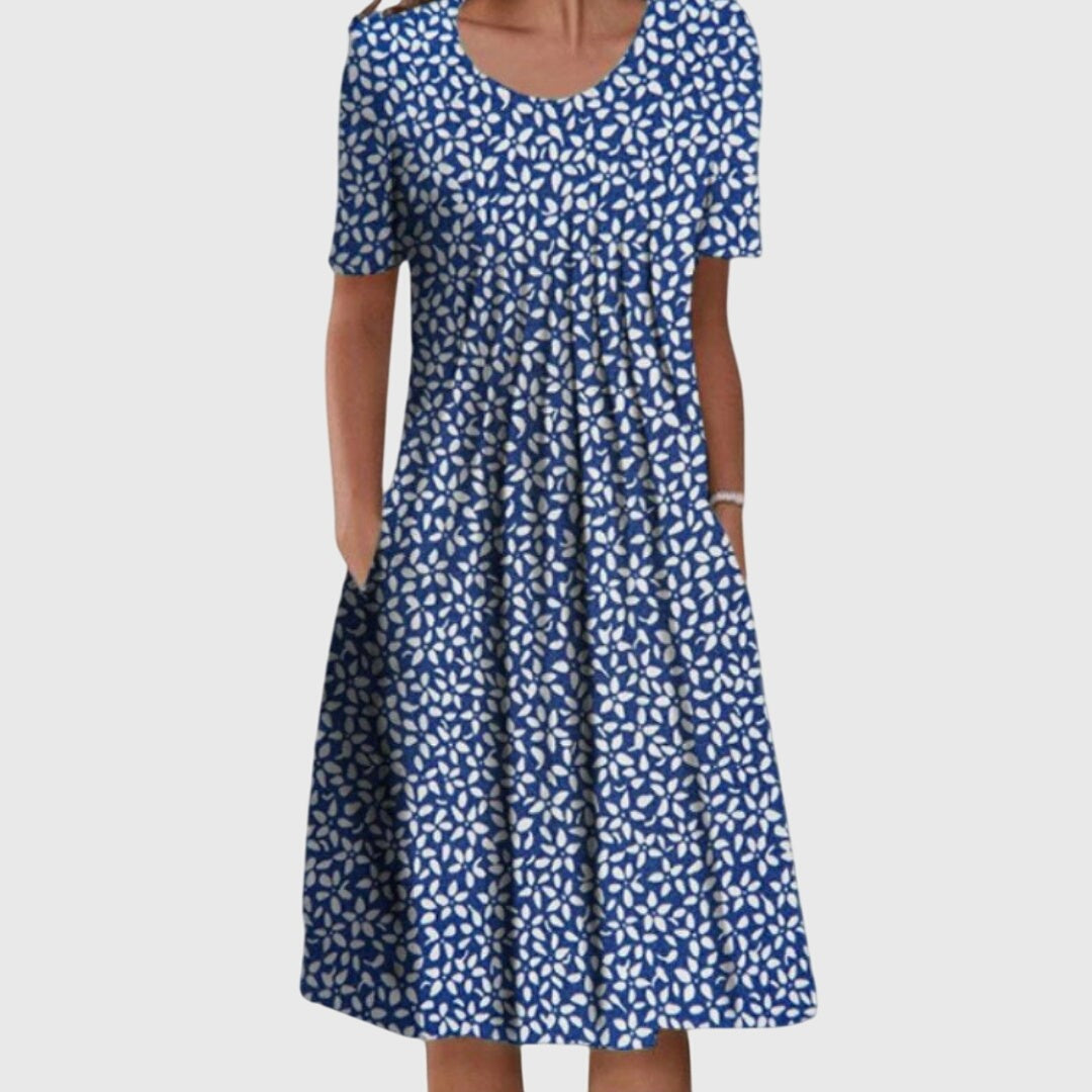 Navy swing dress featuring an all-over white petal print