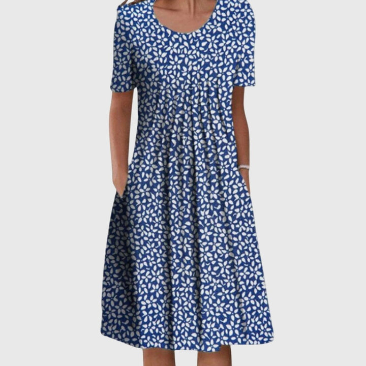 Navy swing dress featuring an all-over white petal print