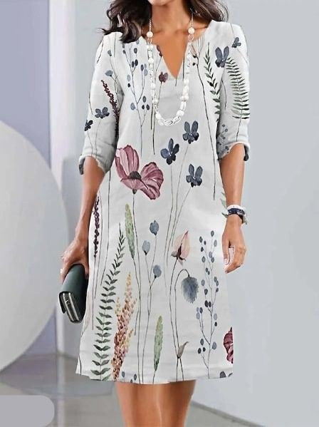 White wildflower print tunic dress with three-quarter sleeves