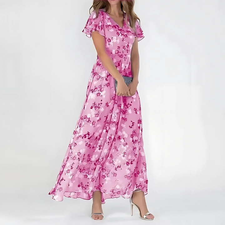 Pink floral print maxi dress with ruffled sleeves and flowing skirt