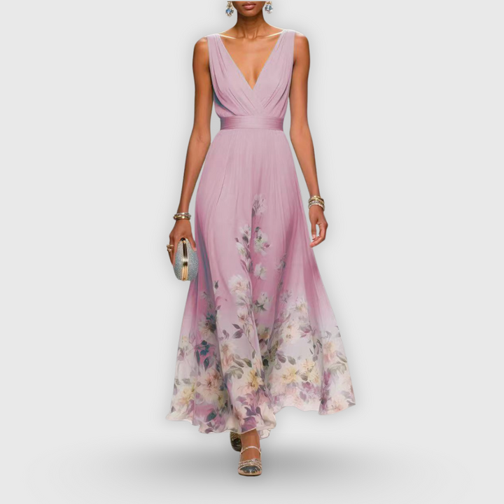 Dusty pink V-neck maxi dress featuring floral hem print and flowing silhouette