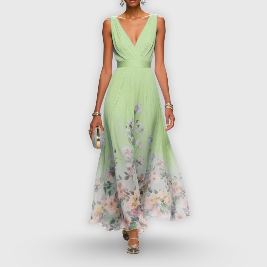 Sage green V-neck maxi dress with floral border print and flowing chiffon skirt
