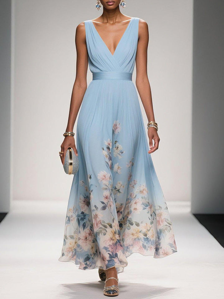 Pale blue floral print maxi dress with pleated V-neck bodice and flowing skirt