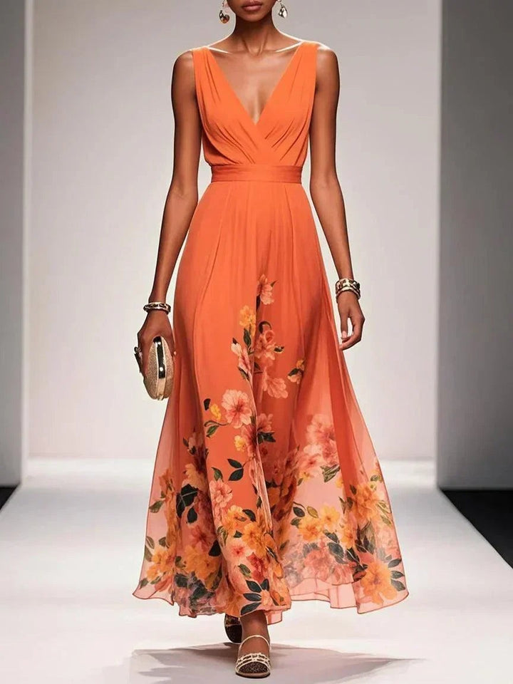 Burnt orange floral print maxi dress with pleated V-neck and flowing hemline