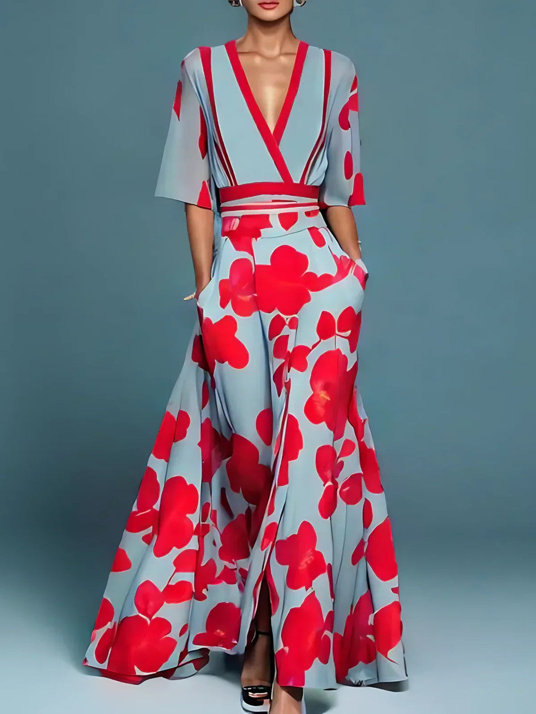 Pale blue maxi dress with bold red floral print and V-neck design