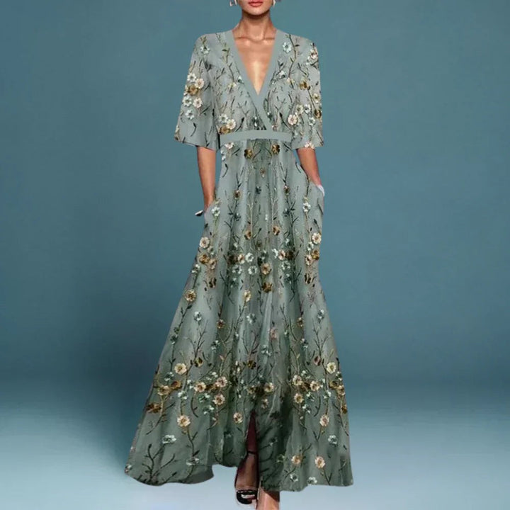 Sage green maxi dress with floral embroidery and plunging V-neckline