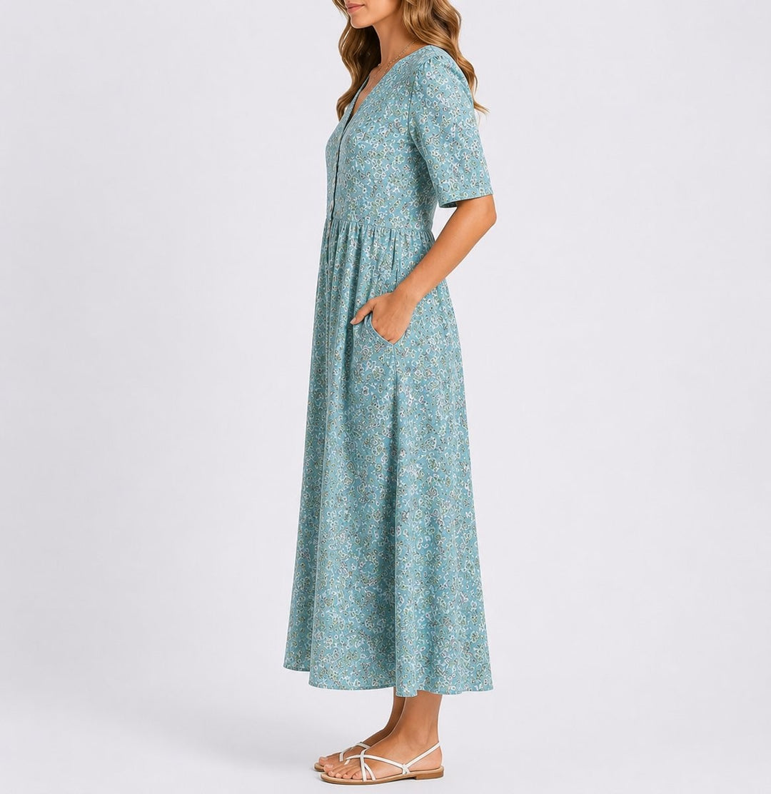 Side view of floral midi dress showing button-front detail and A-line skirt