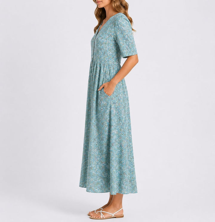 Side view of floral midi dress showing button-front detail and A-line skirt