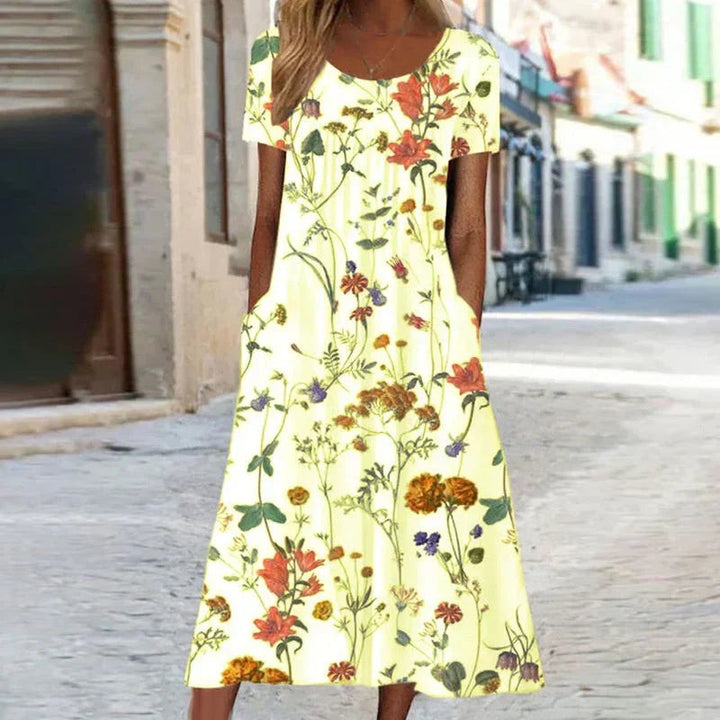 Pale yellow floral maxi dress featuring botanical print and round neckline