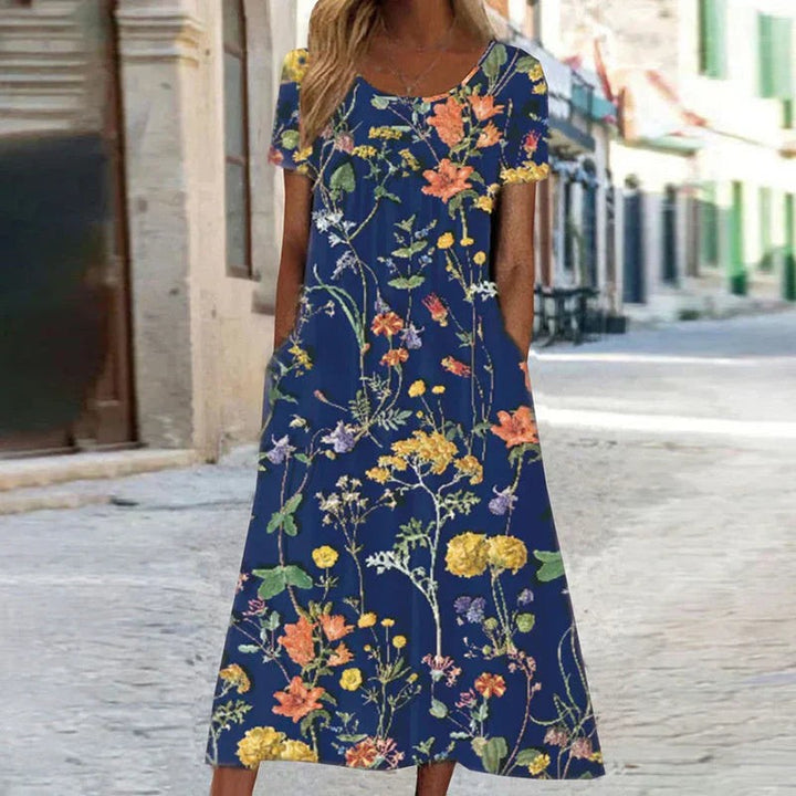 Navy floral maxi dress showcasing vibrant wildflower print and relaxed silhouette