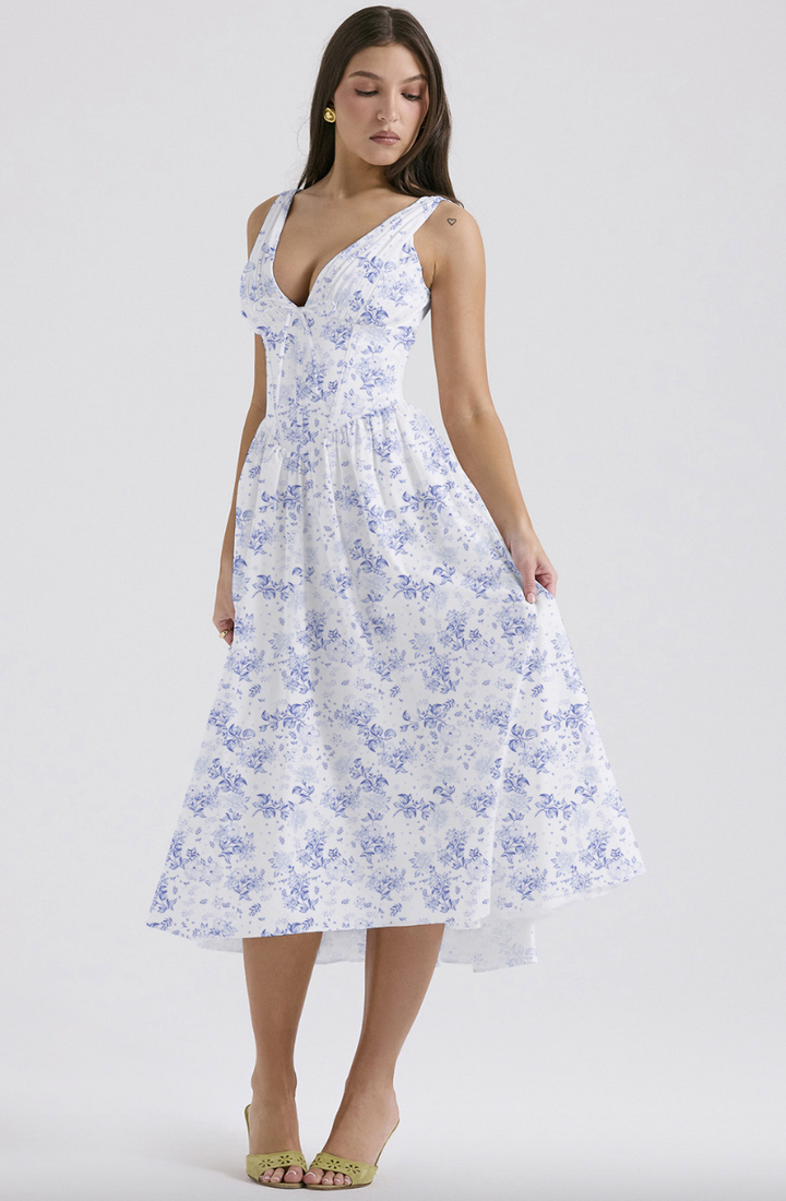 Blue floral print midi dress with sweetheart neckline on model