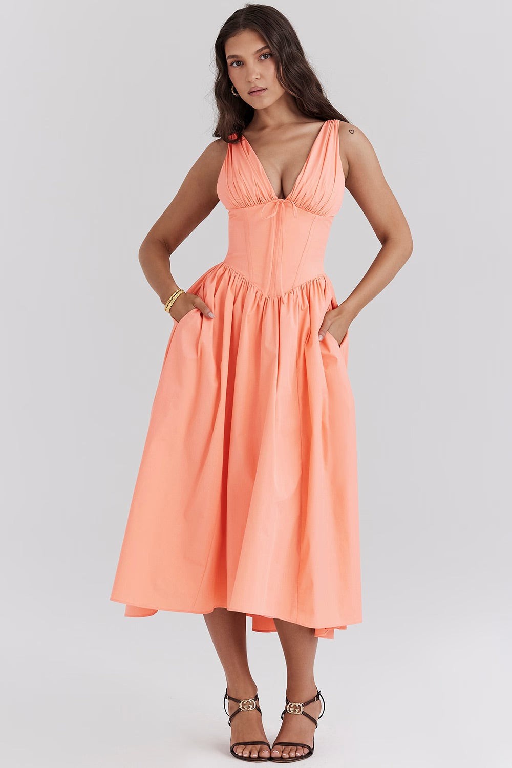 Coral sleeveless corset midi dress with plunge neckline and pockets