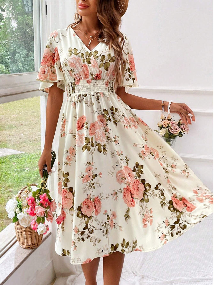 Cream floral midi dress with V-neck, flutter sleeves and shirred waist