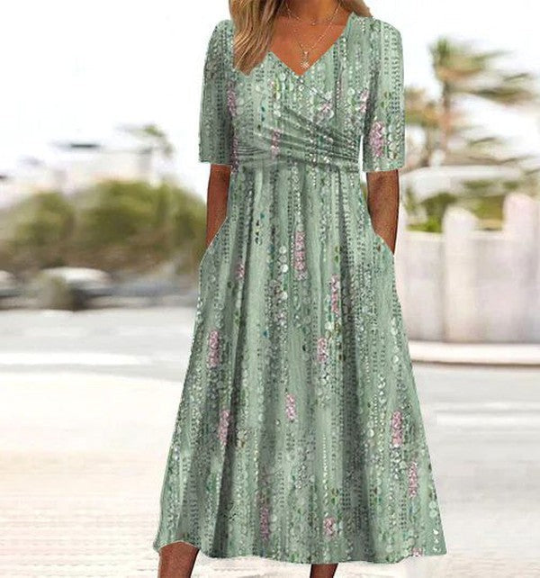 Sage green floral midi dress with V-neck, ruched waist and pockets