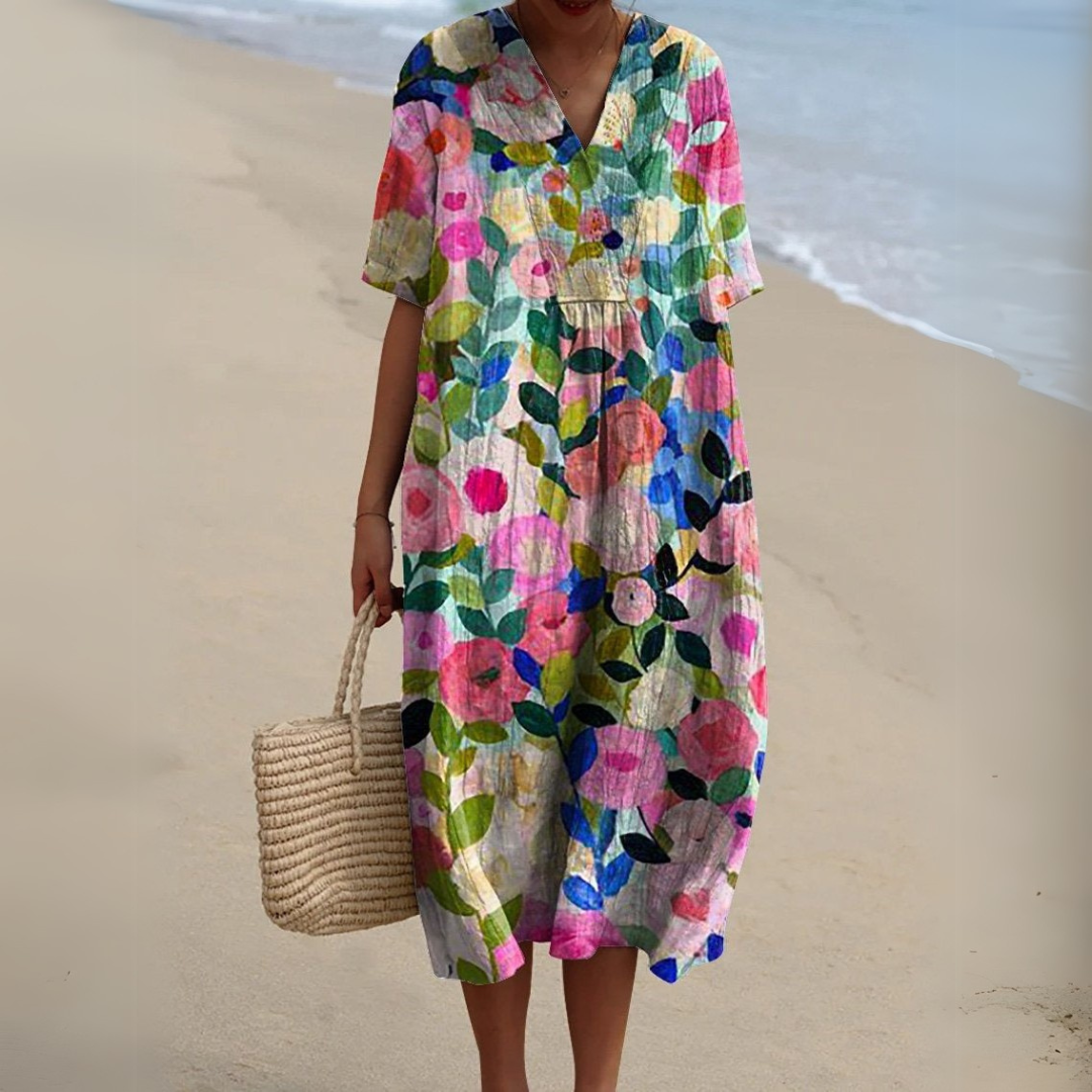 Multicolour floral print V-neck midi dress with short sleeves on beach