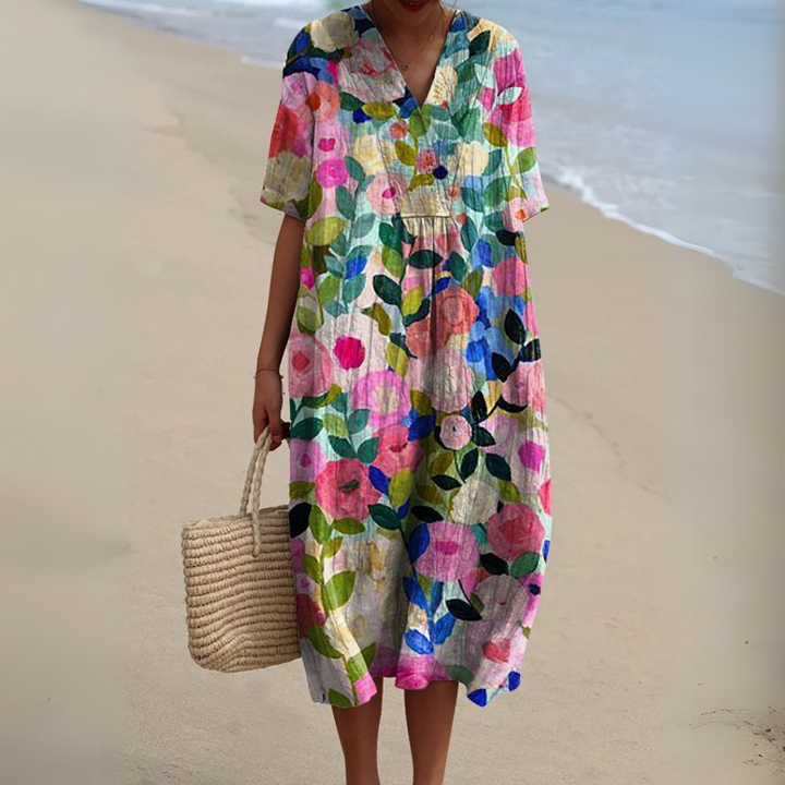 Multicolour floral print V-neck midi dress with short sleeves on beach