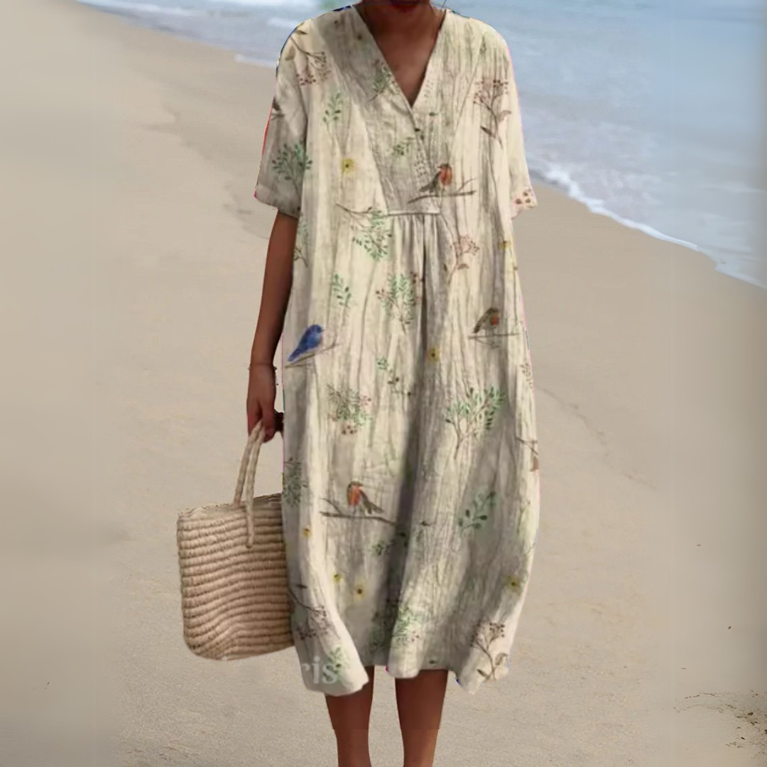 Ivory V-neck midi dress featuring botanical print with perched birds
