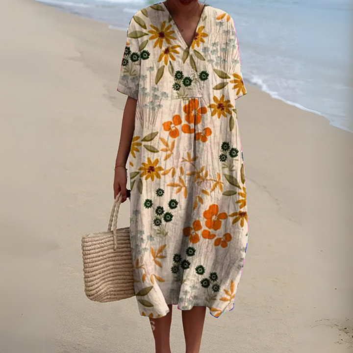 Cream midi dress with vibrant orange and yellow wildflower print